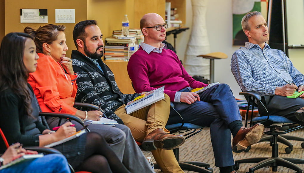 Group of people sitting in a meeting